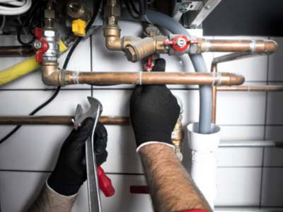 Engle Services HVAC Technician Working on AC Unit